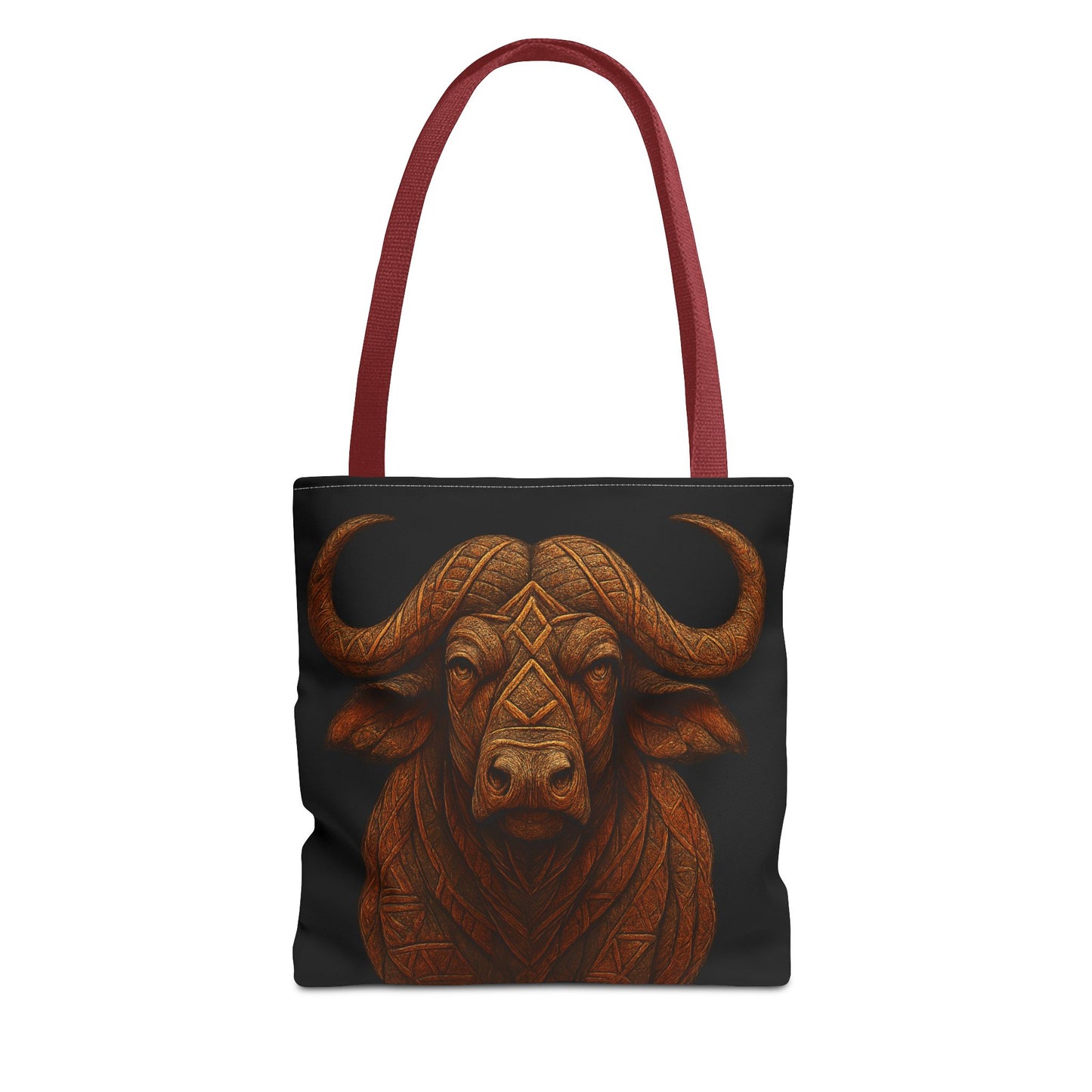 Mashafrica tote bag with carved buffalo head design in brown on black canvas and red shoulder straps