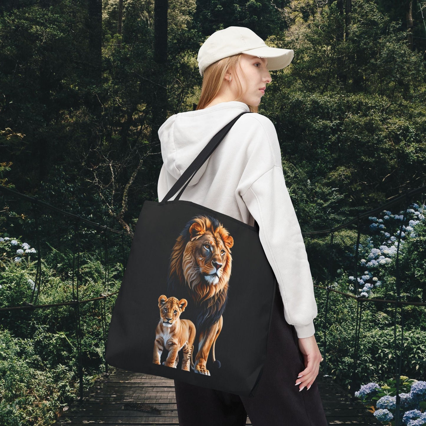 Mashafrica black canvas tote bag with lion and cub print carried by woman outdoors