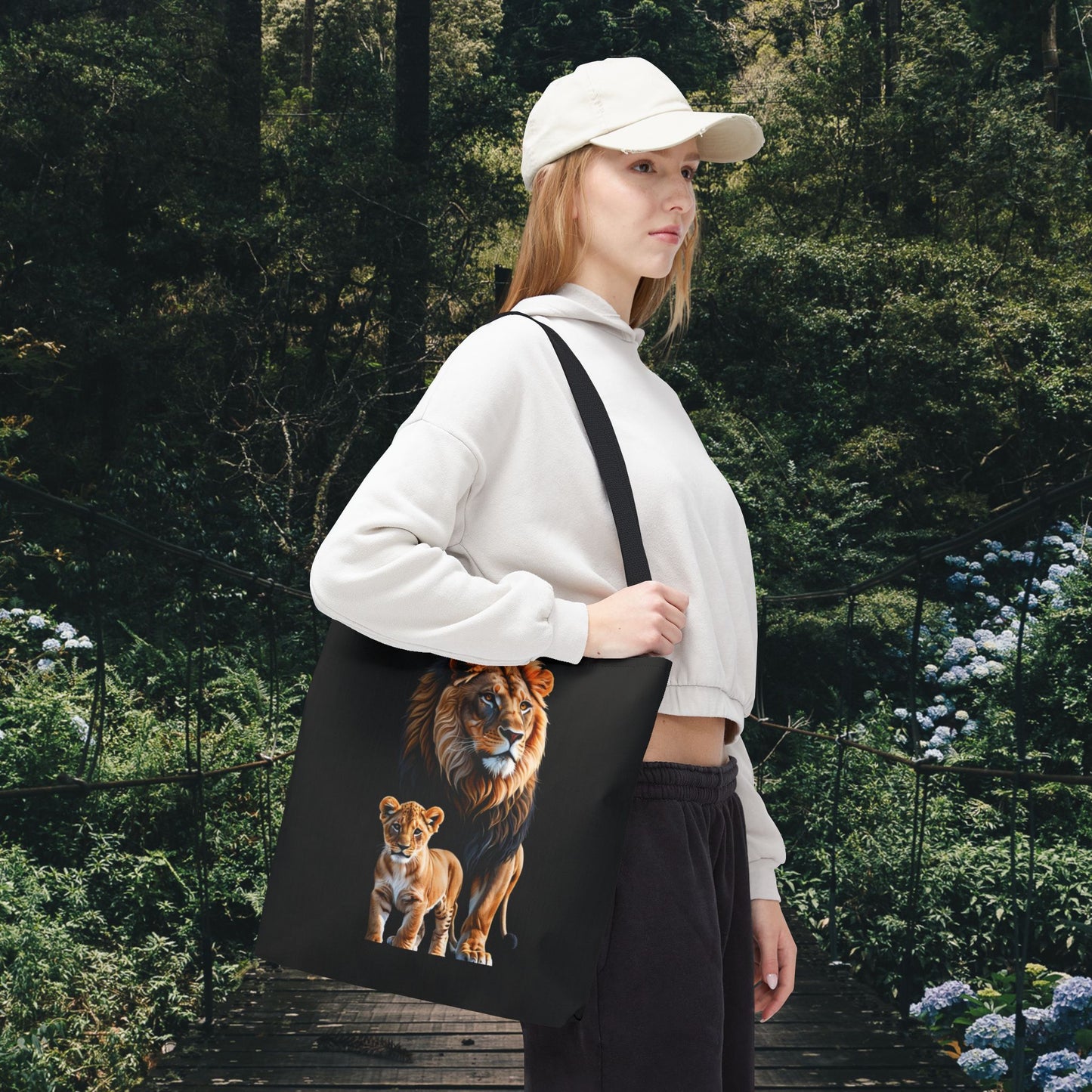 Mashafrica black tote bag with realistic lion and cub print carried by woman in casual outfit