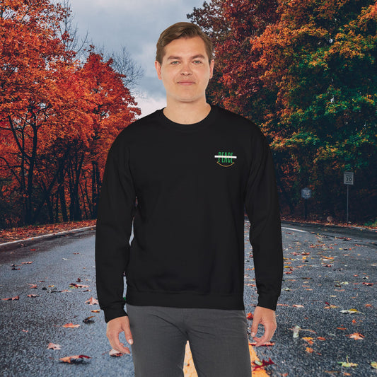 Mashafrica black crewneck sweatshirt on male model with small peace chest logo and autumn road backdrop