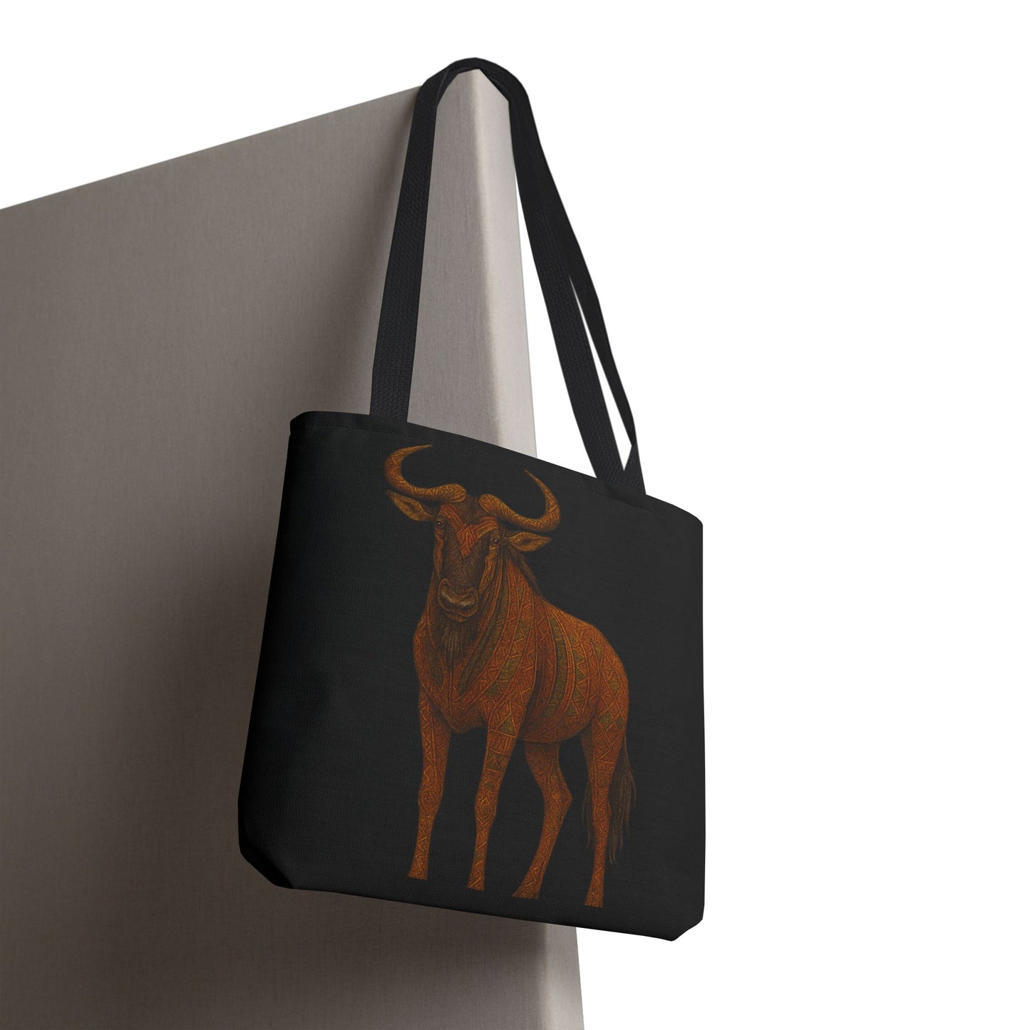 Mashafrica black tote bag with rust orange wildebeest illustration on canvas and long shoulder straps