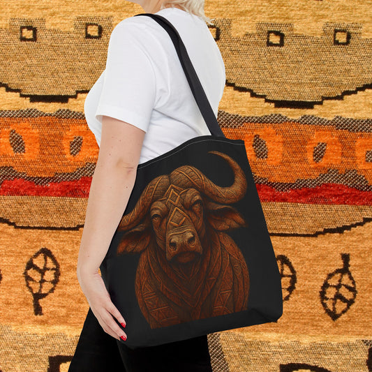 Mashafrica tote bag black with carved wood style buffalo head print on front carried over shoulder