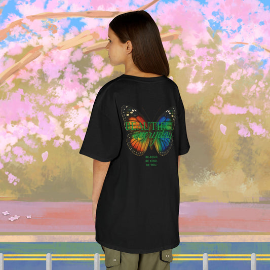 Mashafrica kids black oversized graphic t shirt with colorful Butterfly wing print on back worn by child