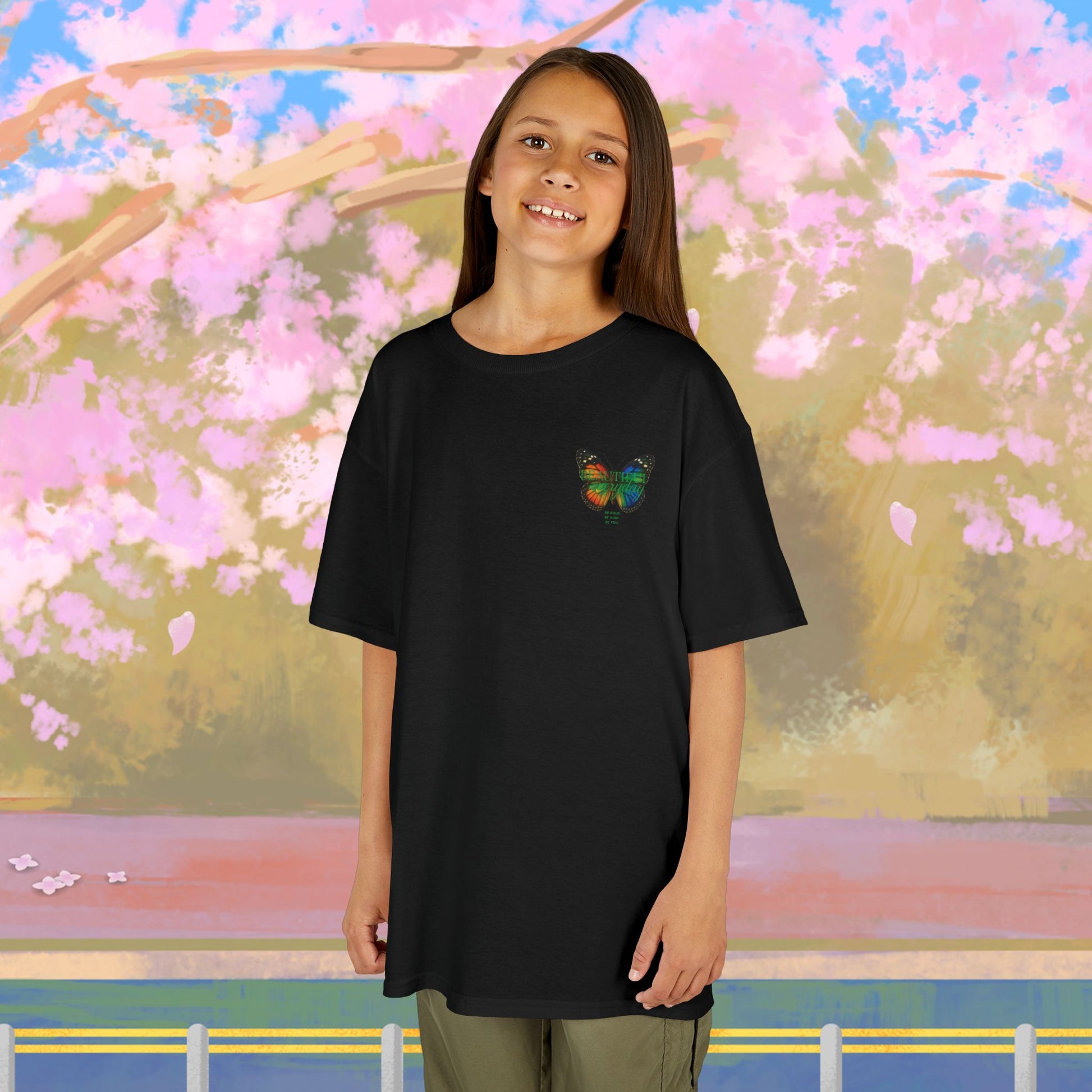 Mashafrica kids clothes black oversized tee with colorful Butterfly chest print worn by smiling girl
