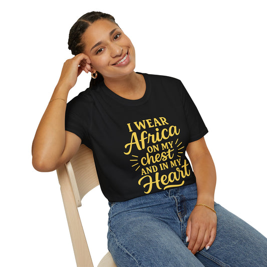 Mashafrica black T Shirt on smiling woman seated gold script reads I wear africa on my chest and in my heart