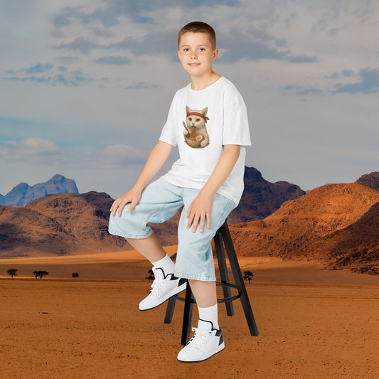 Mashafrica kids ninja graphic white t shirt worn by boy seated on stool with light denim shorts
