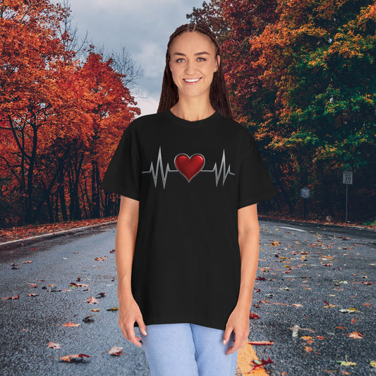 Mashafrica black T shirt with red heart and EKG heartbeat graphic worn by woman on autumn road