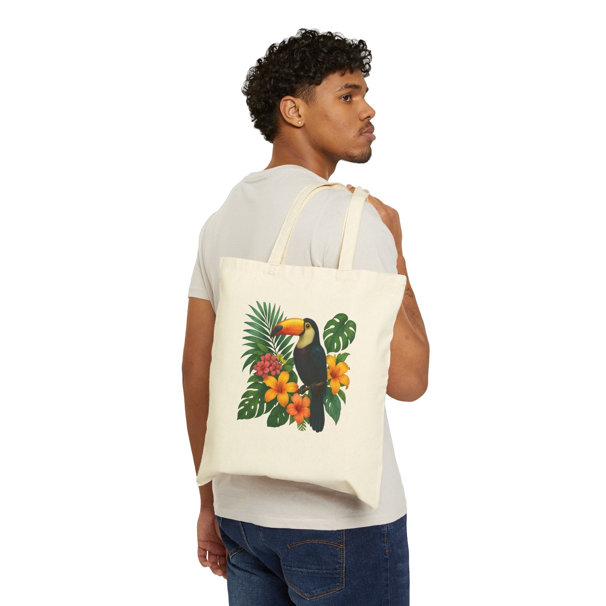 Mashafrica canvas tote bag with tropical toucan print and hibiscus flowers carried on shoulder